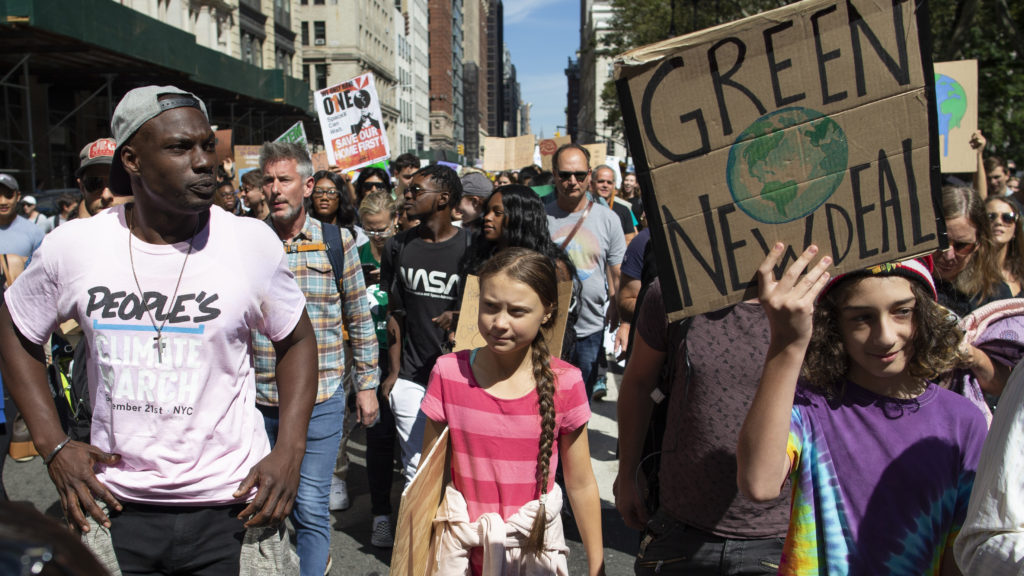 Swedish environmental activist Greta Thunberg, center, takes part during the Climate Strike, Friday, Sept. 20, 2019 in New York. Rallies calling for action on climate change are happening in cities around the world Friday ahead of a summit on the issue. (AP Photo/Eduardo Munoz Alvarez)