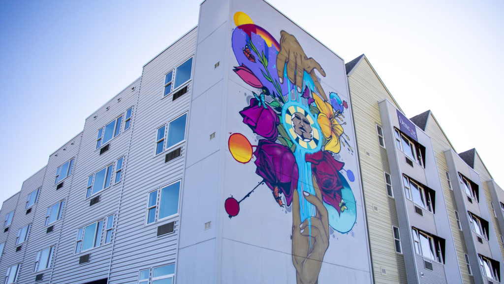 A mural by Jolt on a new housing project at Laradon in Globeville. Nov. 8, 2019. (Kevin J. Beaty/Denverite)