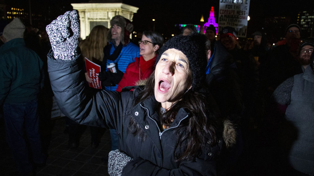 Brenna Hatmai screams a protest chant during a rally supporting the impeachment of President Donald Trump at the state Capitol, Dec. 17, 2019. (Kevin J. Beaty/Denverite)