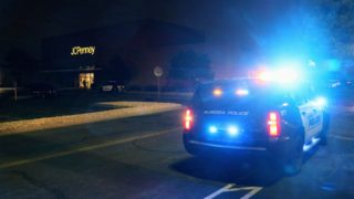 An Aurora police cruiser outside the Town Center at Aurora mall on Friday, Dec. 27, in Aurora. (Kevin J. Beaty/Denverite)