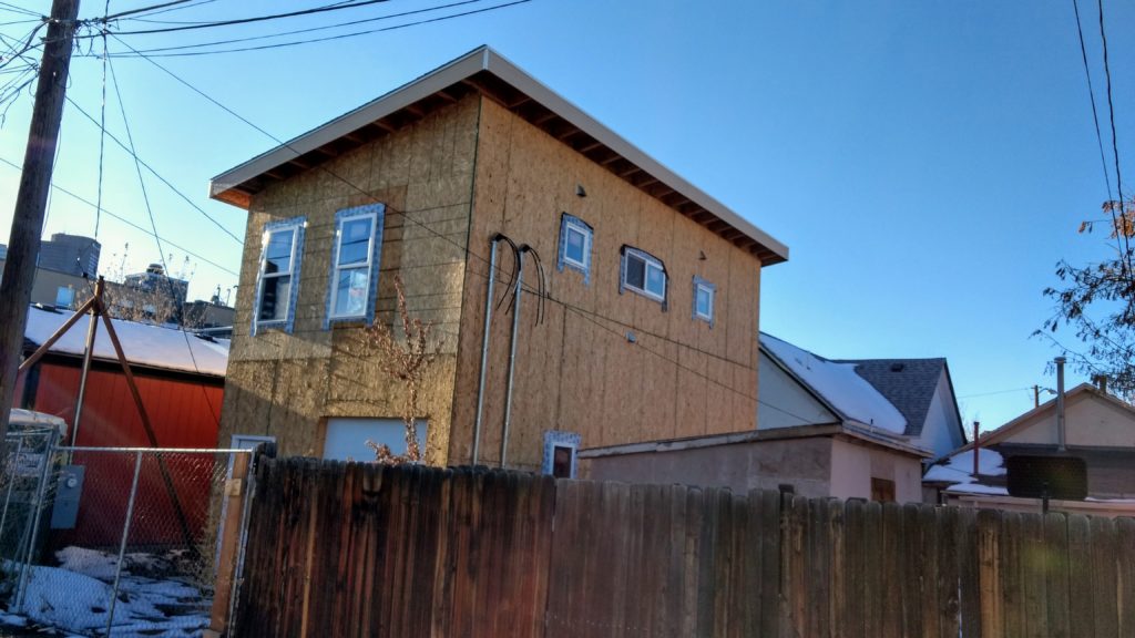 This almost completed house at 2444 Tremont Place, pictured Dec. 3, 2019, is at the center of a zoning fight. (Donna Bryson/Denverite)