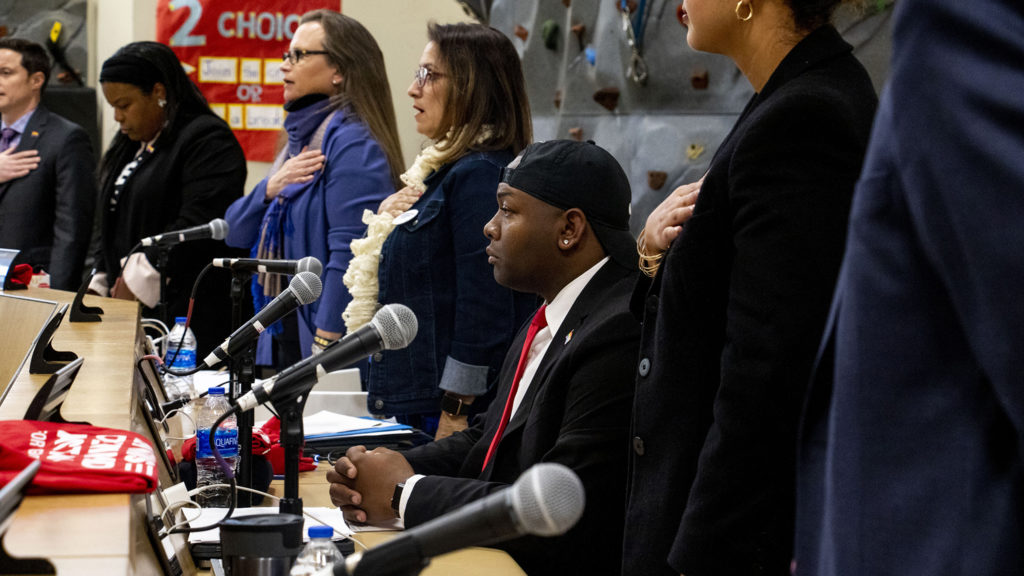 Tay Anderson was the only Denver School Board member not to stand during the Pledge of Allegiance, Jan. 23, 2020. (Kevin J. Beaty/Denverite)