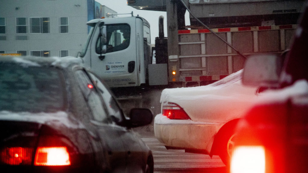 A plow amid traffic, Feb. 3, 2020. (Kevin J. Beaty/Denverite)