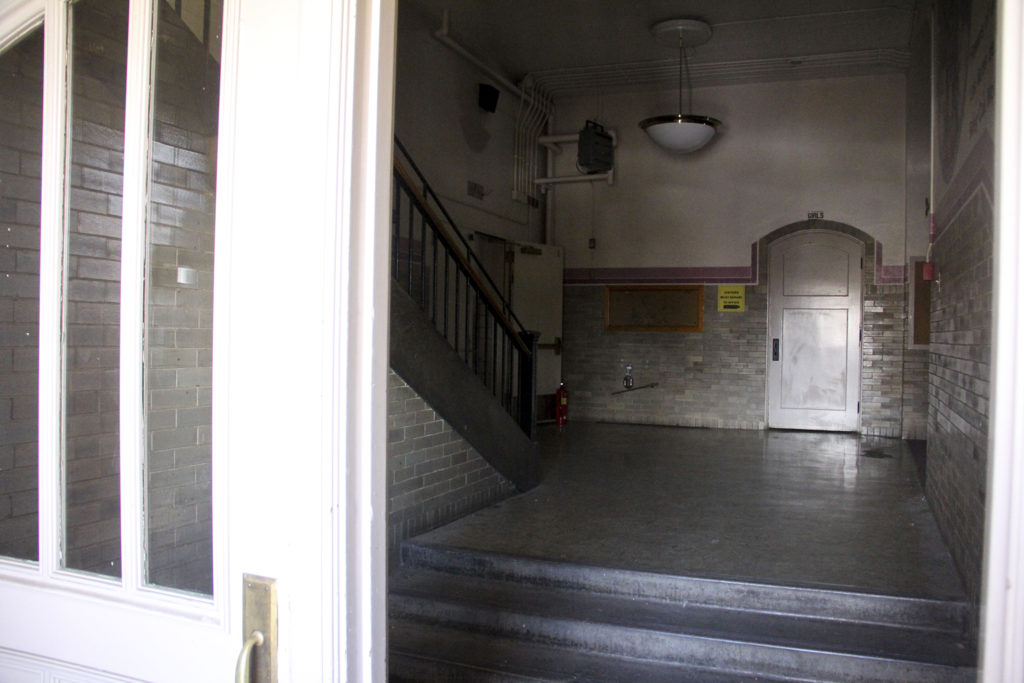 The entrance to the old Rosedale School in Denver's Rosedale neighborhood, Feb. 24, 2020. (Esteban L. Hernandez/Denverite)