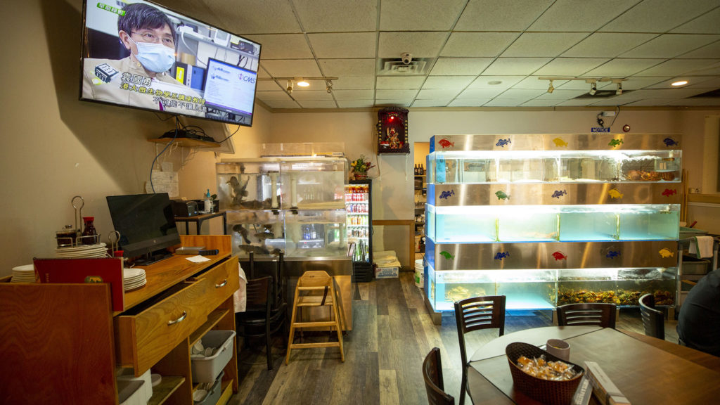 A Chinese TV news report about the new coronavirus plays on a TV inside Star Kitchen, the dim sum restaurant near the intersection of Mississippi Avenue and Federal Boulevard. Feb. 25, 2020. (Kevin J. Beaty/Denverite)