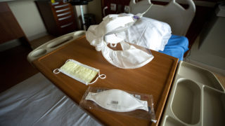 An array of medical masks on a bed at St. Joseph Hospital, March 10, 2020. (Kevin J. Beaty/Denverite)