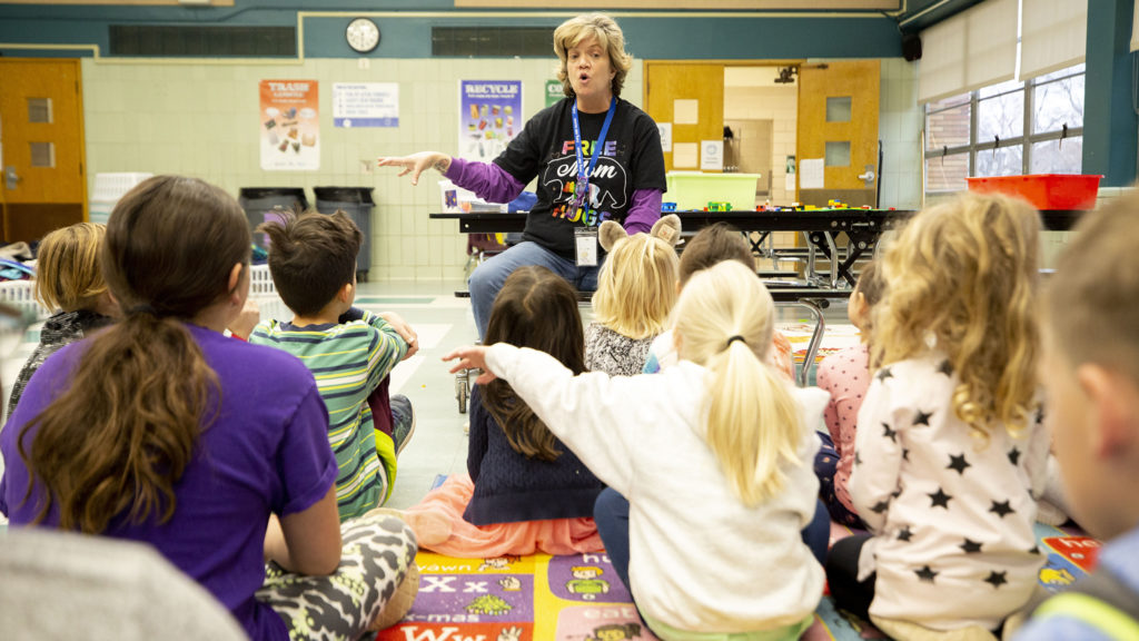 Discovery Link supervisor Jennifer Piel teaches kids at Carson Elementary how to wash their hands. March 13, 2020. (Kevin J. Beaty/Denverite)