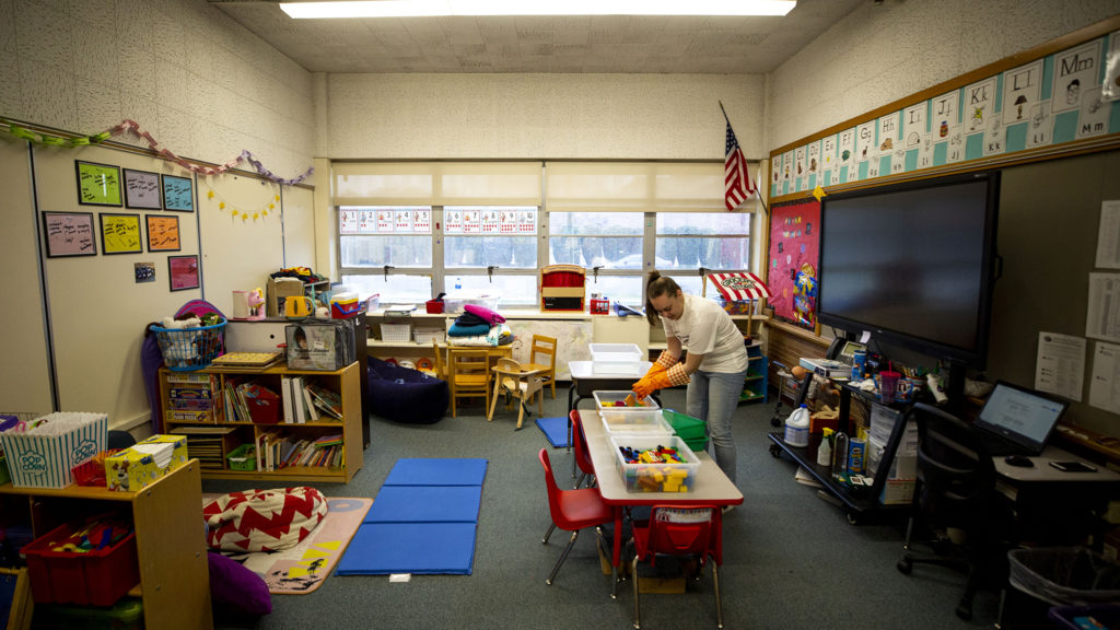 Saralyn Voltz bleaches toys in her preschool classroom at Carson Elementary, March 13, 2020. (Kevin J. Beaty/Denverite)