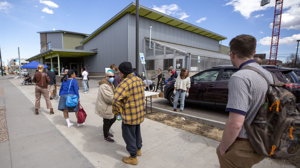 Metro Caring food pantry had to conduct business outside due to COVID-19 concerns, March 18, 2020. (Kevin J. Beaty/Denverite)