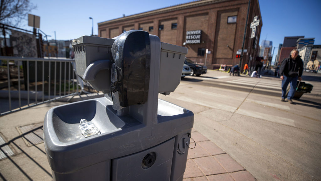 A hand sanitizing station across the street from the Denver Rescue Mission and Samaritan House shelters. March 24, 2020. (Kevin J. Beaty/Denverite)