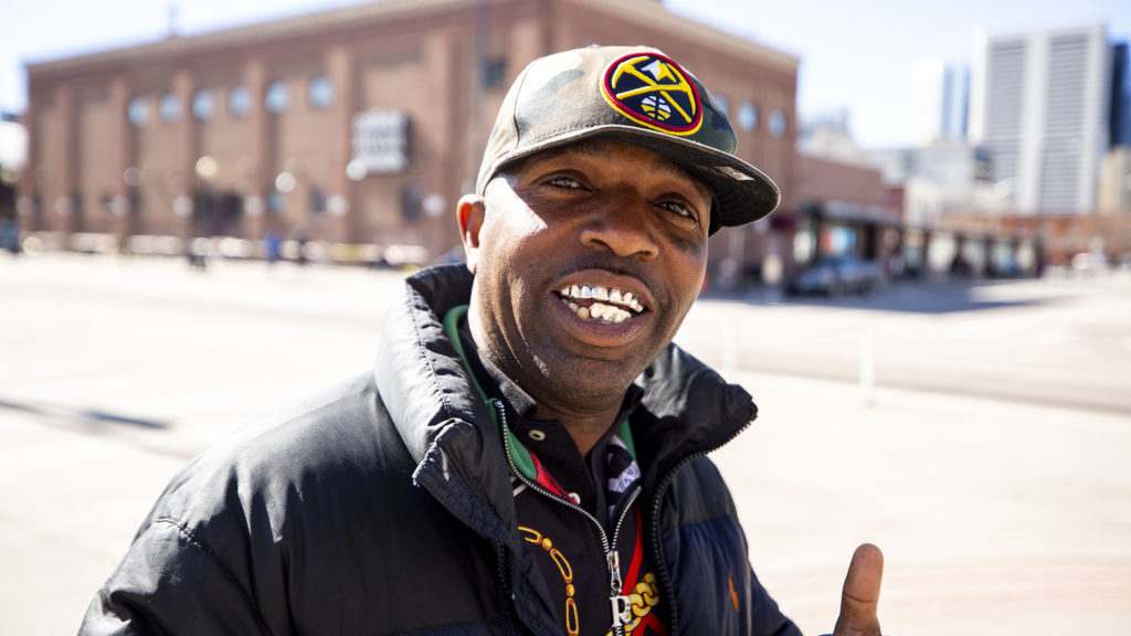 Scott poses for a photo across the street from the Denver Rescue Mission. March 24, 2020. (Kevin J. Beaty/Denverite)