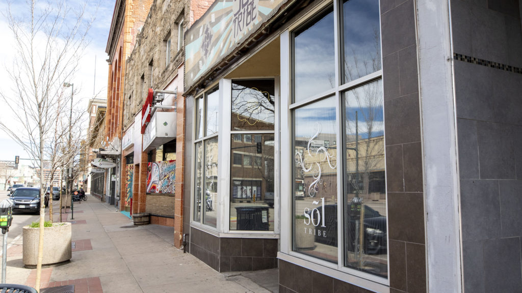 Sol Tribe Tattoo and Piercing on Broadway is boarded up from the inside. April 1, 2020. (Kevin J. Beaty/Denverite)