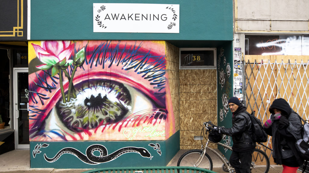 Awakening Boutique on Broadway is boarded up and muraled. April 2, 2020. (Kevin J. Beaty/Denverite)