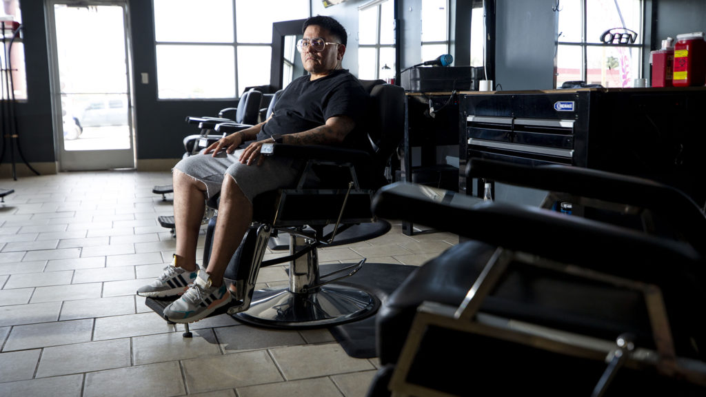 Francisco Martinez, owner of Cisco's Barbershop, sits in his Westwood shop. April 25, 2020. (Kevin J. Beaty/Denverite)