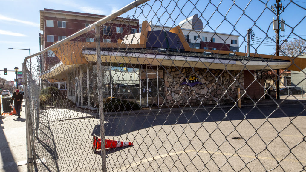 Tom's Diner has a fence around it. North Capitol Hill, April 29, 2020. (Kevin J. Beaty/Denverite)