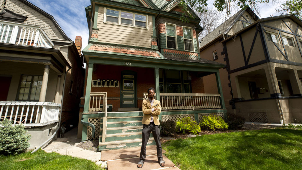 Playwright Brenton Weyi poses for a picture outside of his City Park West home. May 13, 2020. (Kevin J. Beaty/Denverite)