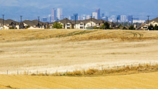 Downtown Denver seen from the future site of the Painted Prairie, a developing neighborhood by DIA in Aurora. May 14, 2020. (Kevin J. Beaty/Denverite)