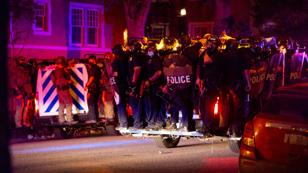 Riot police ride past the Capitol as protesters react to the killing of George Floyd. May 28, 2020. (Kevin J. Beaty/Denverite)