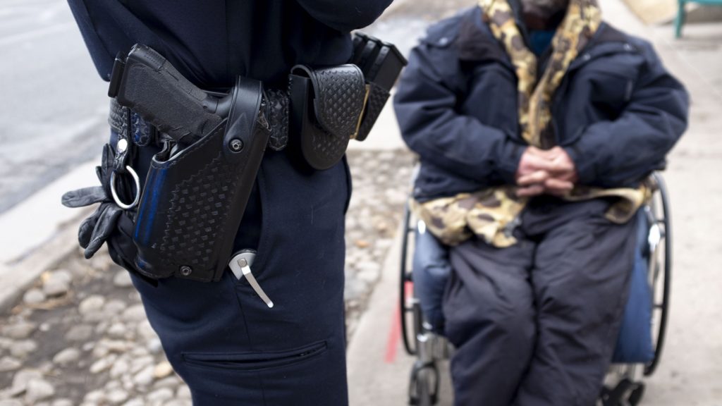 Westminster Police Sgt. Alex Johnstone speaks to a man who asked to be taken to detox, Jan. 30, 2020. (Kevin J. Beaty/Denverite)