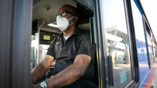 An RTD driver in a face mask waits at RTD’s Central Park Station Thursday morning, April 9, 2020. The Regional Transportation District could lose a quarter of a billion dollars in revenue, and potentially more, because of fallout over work, jobs and the economy because of coronavirus.