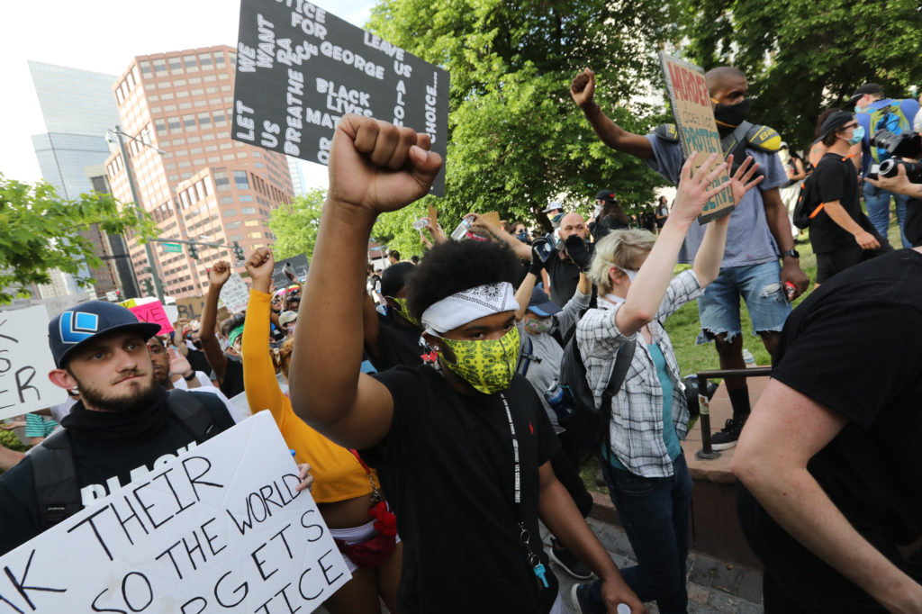 Denver Police Chief Paul Pazen marches and speaks with demonstrators on Monday, June 1, 2020, as they peacefully protest the death of George Floyd at the hands of Minneapolis police. (Hart Van Denburg/CPR News)