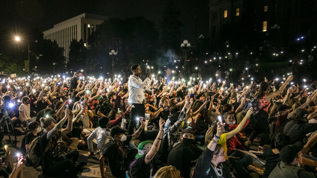 After speeches at Civic Center Park, the protesters against police brutality moved to Lincoln Street in front of the state Capitol on Wednesday, June 3, 2020. At about 10 p.m. — an hour past curfew — they held phones aloft and stayed silent for nine minutes in honor of George Floyd, the African American man who was killed by Minneapolis police. Denver police blocked off the roads around the Capitol to give the demonstrators room but otherwise held their distance at least until 11 p.m.