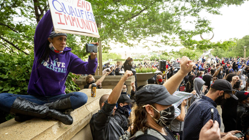 Elisabeth Epps (left) livestreams a rally in memory of Elijah McClain, who died after an interaction with Aurora police in 2019. June 6, 2020. (Kevin J. Beaty/Denverite)