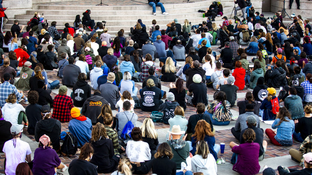 Tay Anderson sits for an "intimate" discussion with the crowd during a vigil for George Floyd at Civic Center Park. June 9, 2020. (Kevin J. Beaty/Denverite)