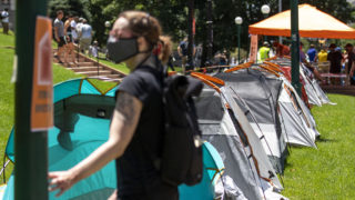The Denver Democratic Socialists of America stage tents in front of the Capitol to protest rent and evictions as the economy continues to struggle under the pandemic. July 1, 2020. (Kevin J. Beaty/Denverite)