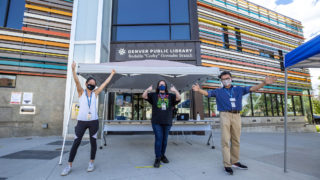 Carly Tam, Julie Martinez and Khoa Hoang are excited to give you books at their curbside pickup location outside of the Corky Gonzales library on West Colfax Avenue. July 7, 2020.