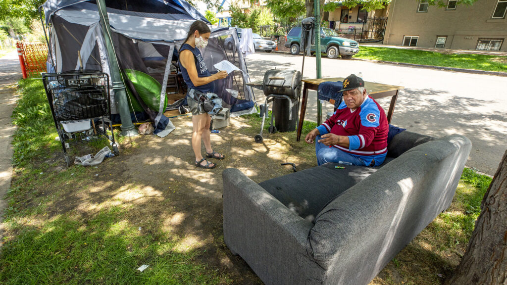 Terese Howard speaks with Vince Martinez during Denver Homeless Out Loud's own count of tents in the city. July 17, 2020.