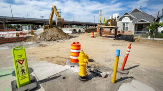 I-70 expansion construction sits just beyond the fence of this home on Columbine Street in Elyria Swansea. July 22, 2020.