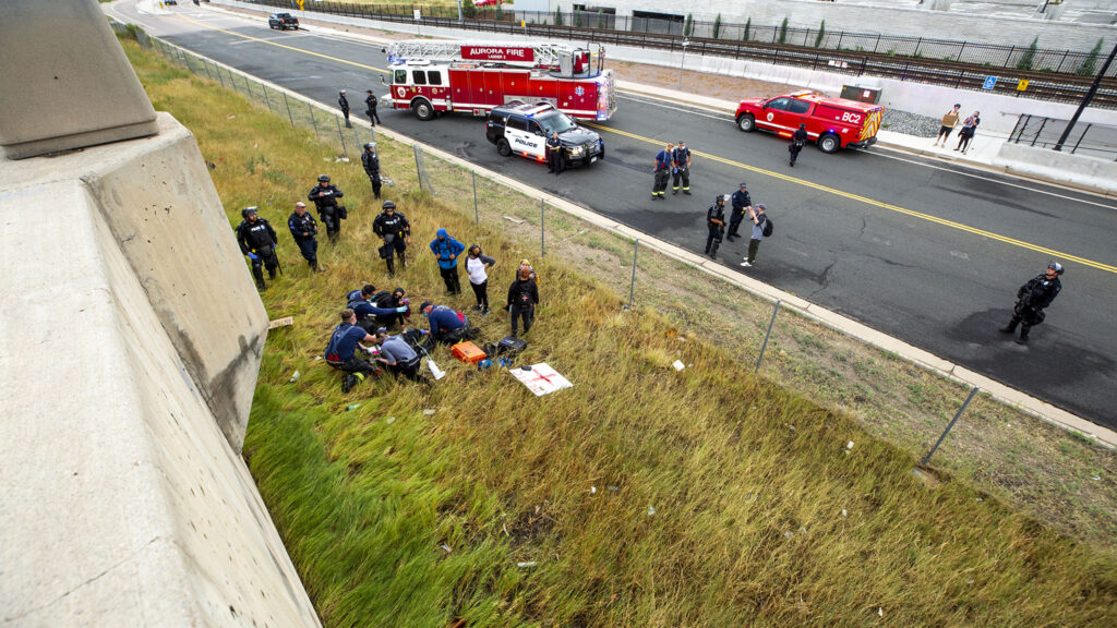 Emergency response vehicles on I-225 in Aurora after a driver sped into protesters on July 25, 2020. The woman below fell from the highway soon after the driver passed and a protester began firing a gun.