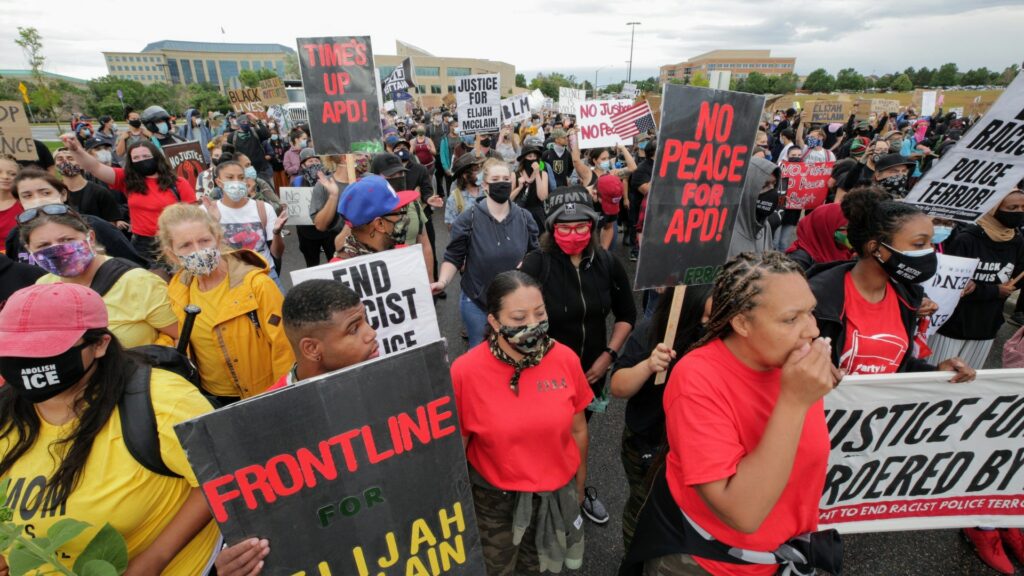 Protesters in Aurora on July 25, 2020, demand justice in the death of Elijah McClain