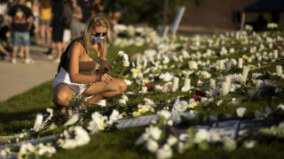 Flowers placed for Elijah McClain during a vigil in Aurora on July 11, 2020
