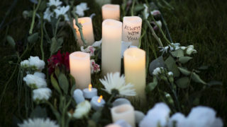 Candles and flowers for Elijah McClain Vigil