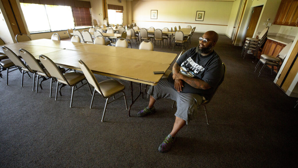 Jason McBride sits inside the Park Hill Golf Course clubhouse, which he'll transform into a safe learning space for remote schooling and more. Aug. 7, 2020.
