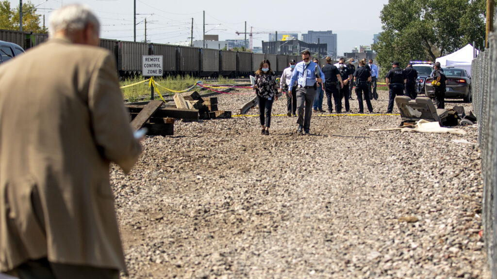 Denver police investigate an officer-involved shooting by a railway near the National Western Center. Aug. 15, 2020.
