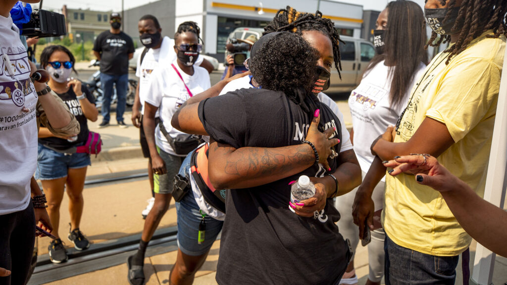 Kela Duncan, Breonna Taylor's aunt, embraces Sheneen McClain, mother to Elijah, as they meet for the first time at Brother Jeff's Cultural Center on Welton Street. Aug. 22, 2020.