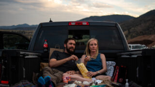 Austin Dyer and Hannah Broughton enjoy popcorn and the movie in their truck bed during the 21st annual Film on the Rocks, drive-in edition at Red Rocks Park on Aug. 13, 2020.