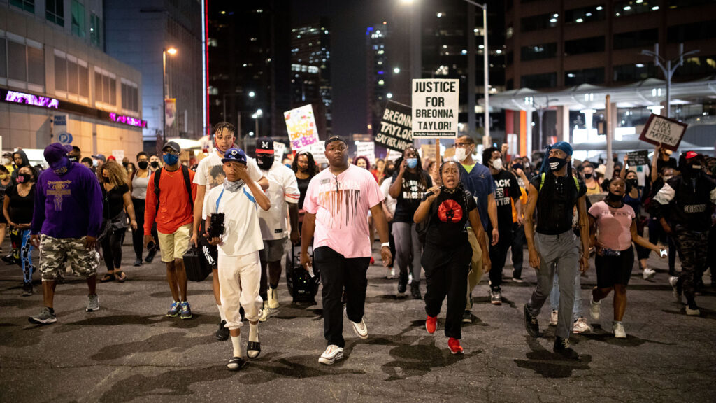 DPS school board member Tay Anderson leads hundreds of demonstrators through downtown Denver on Sept. 23 in Denver.