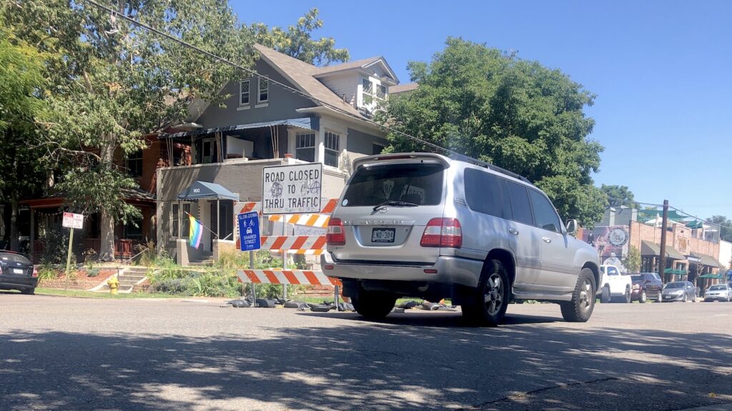 A driver cruises by new barriers on 11th Avenue in Capitol Hill, September 1, 2020.