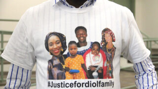 Pap Dia wears a shirt showing the victims of a fire in Green Valley Ranch. From left: Adja Diol, Khadija Diol, Djibril Diol, Hawa Beye and Hassan Diol. (Esteban L. Hernandez/Denverite)