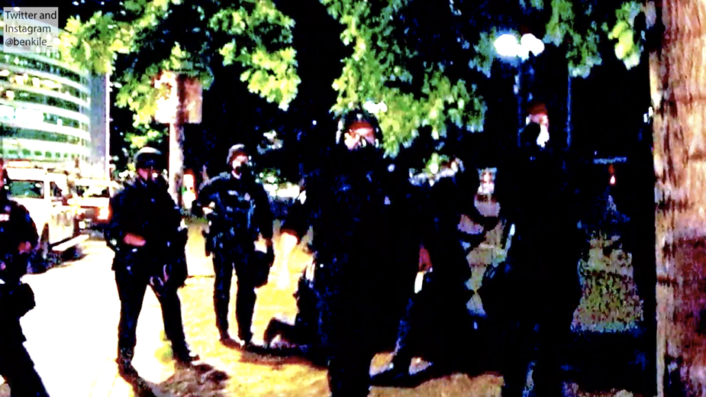 A screen shot of a video captured by Twitter user @benkile_ shows the arrest of Michael Jacobs on July 29, 2020.