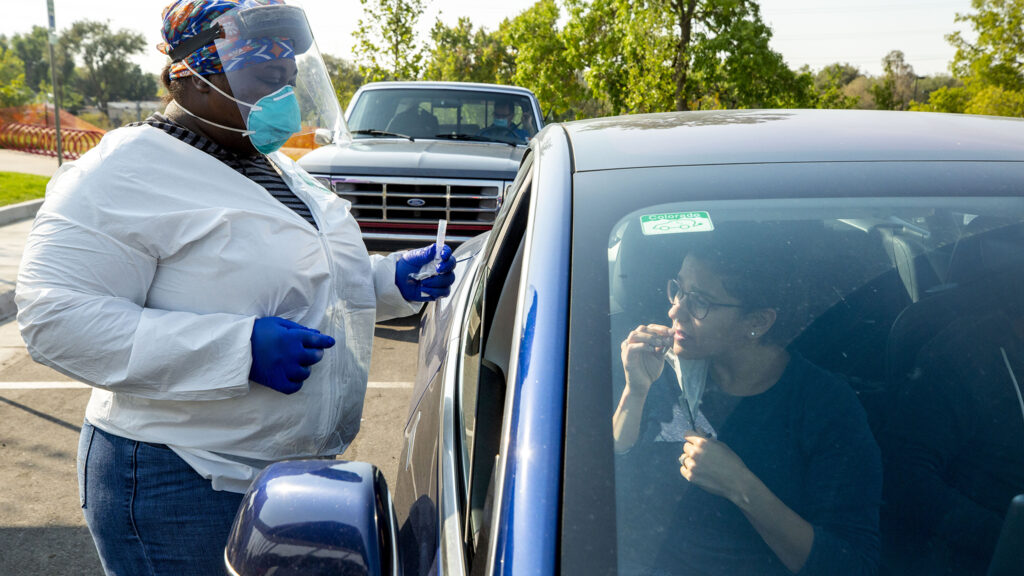 Adolisa Schaefer gets a COVID-19 test at Paco Sanchez Park in West Colfax. Oct. 2, 2020.