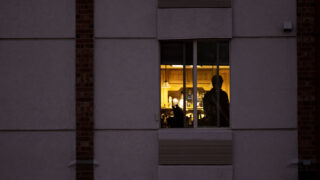 A man stands in a hotel in Centennial. Oct. 6, 2020.