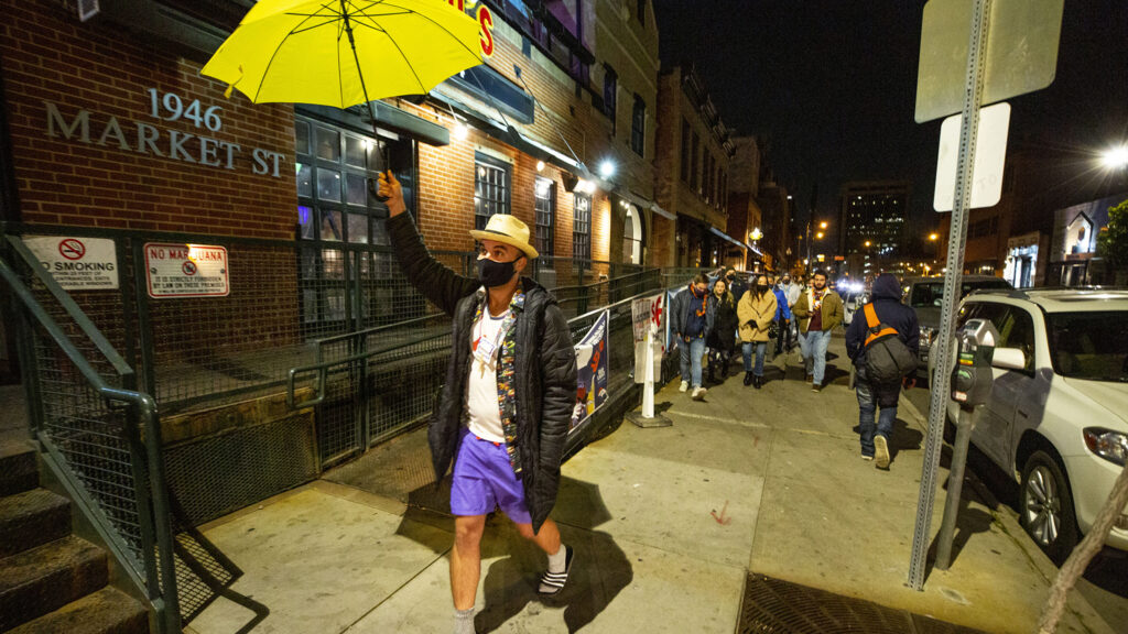 Tyler Sondag leads his Denver Pub Crawl group through LoDo on Oct. 23, 2020.
