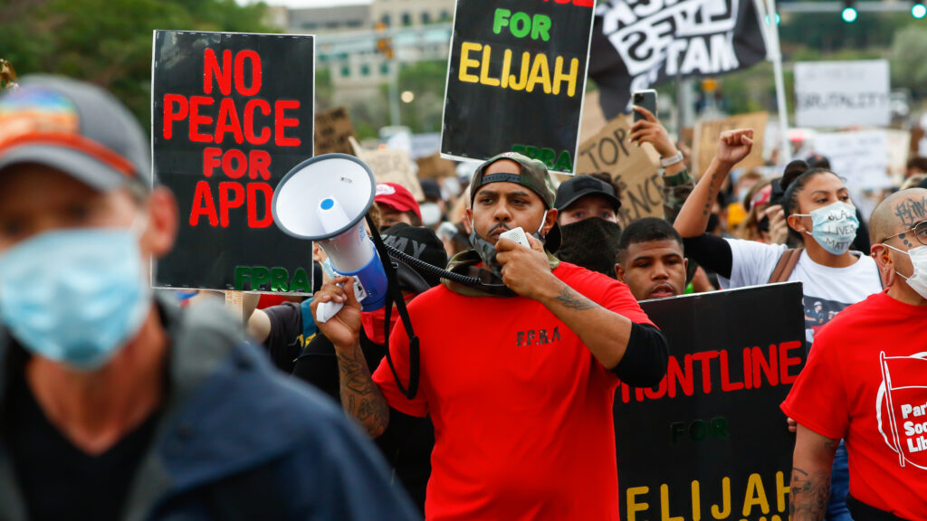 Terrance Roberts leads protesters in a march calling for justice for Elijah McClain in Aurora. July 25, 2020.