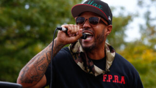 Terrance Roberts leads protesters in calling for an end to police in Aurora, CO, August 30, 2020.