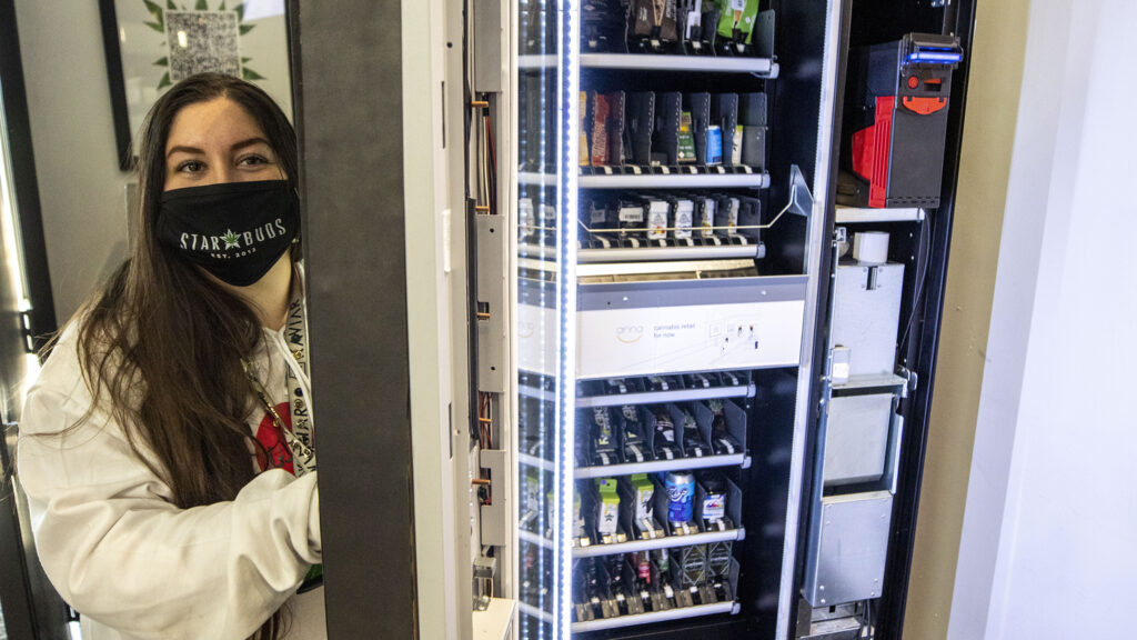 Star Buds lead assistant manager Amanda Cordova opens the new Anna vending machine at their location on Arapahoe Road in Aurora. Oct. 29, 2020.